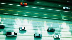 cars on highway in shadow